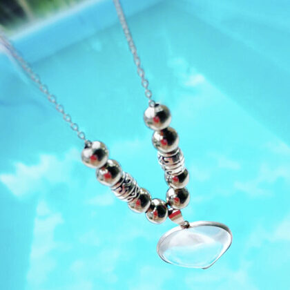 Colgante de acero quirúrgico con Corazón de Cuarzo Cristal con Baño de Plata $1500